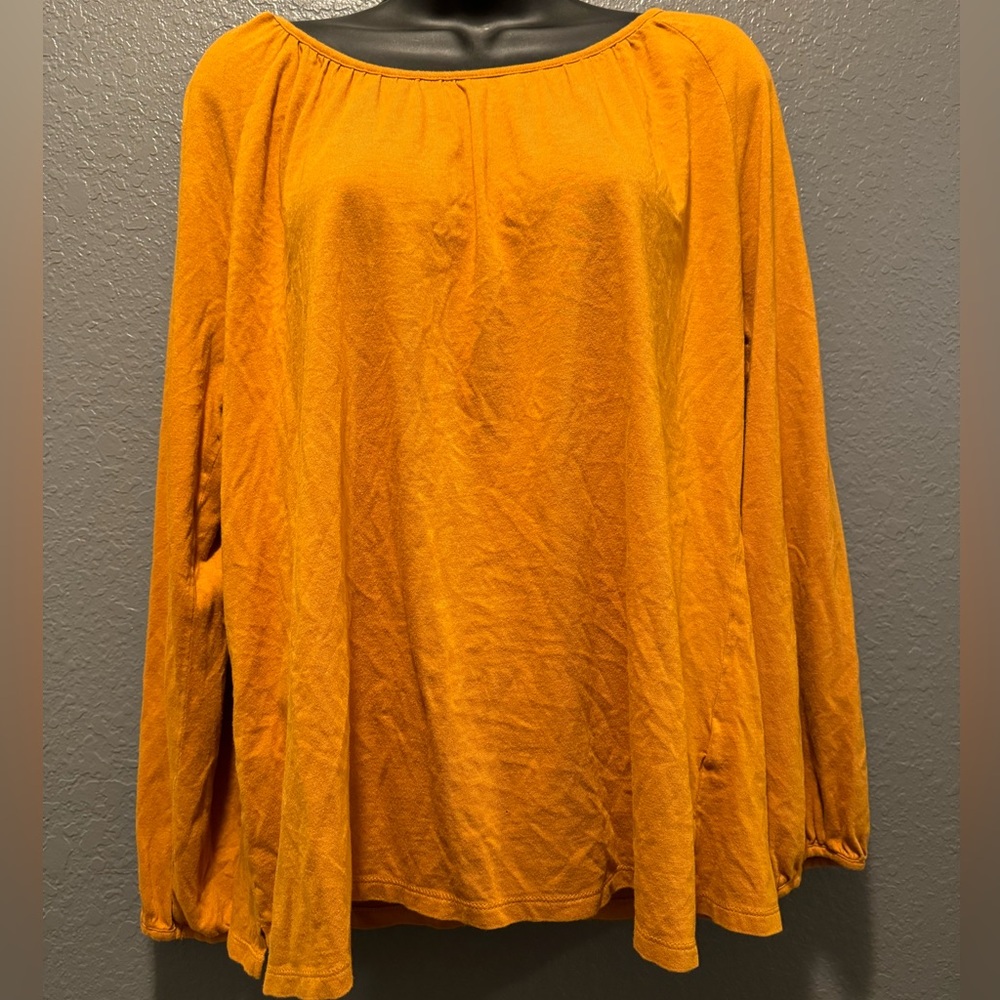 mustard yellow long-sleeved top